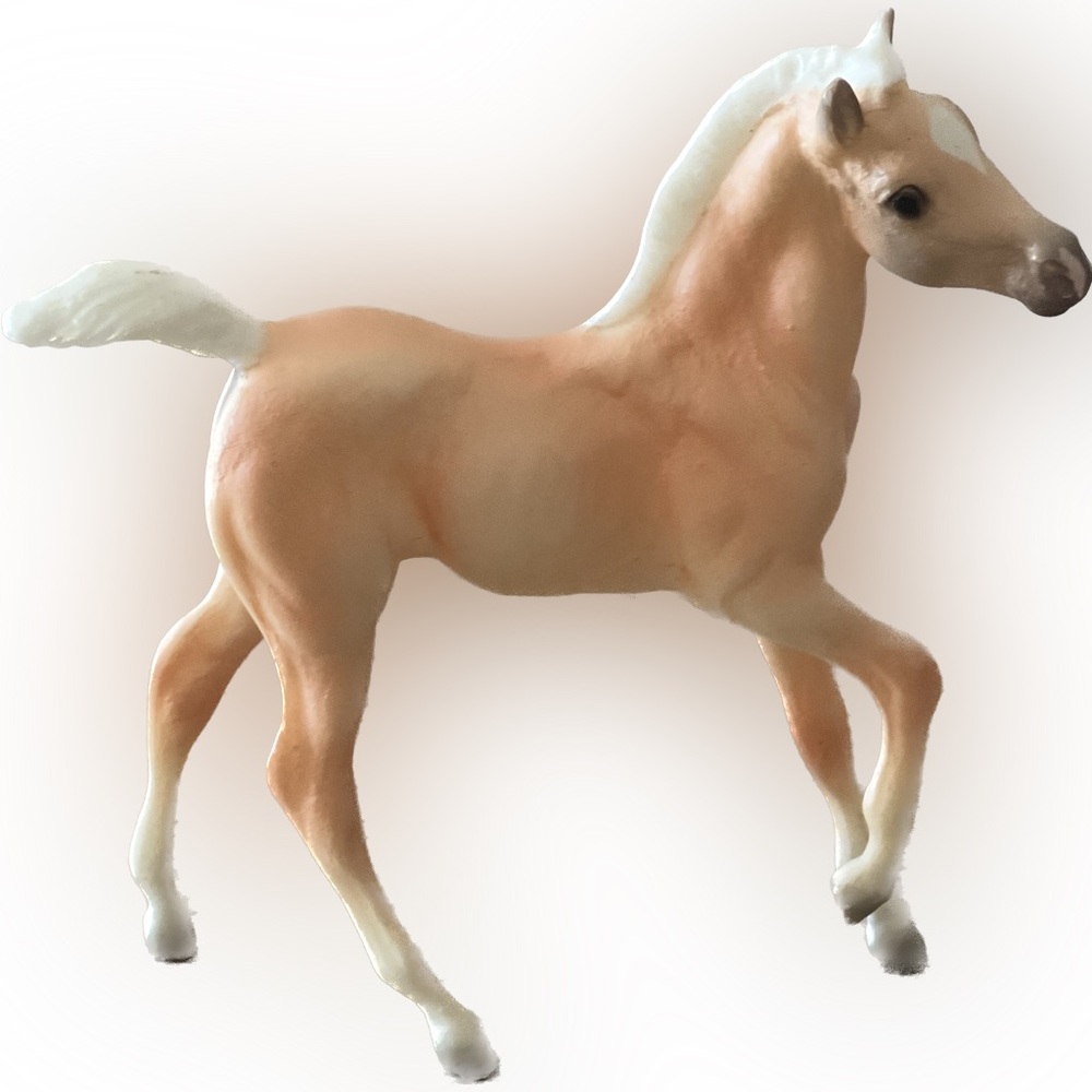 Mini Breyer figurine in Palomino from Cloud Breyer Horse Collection